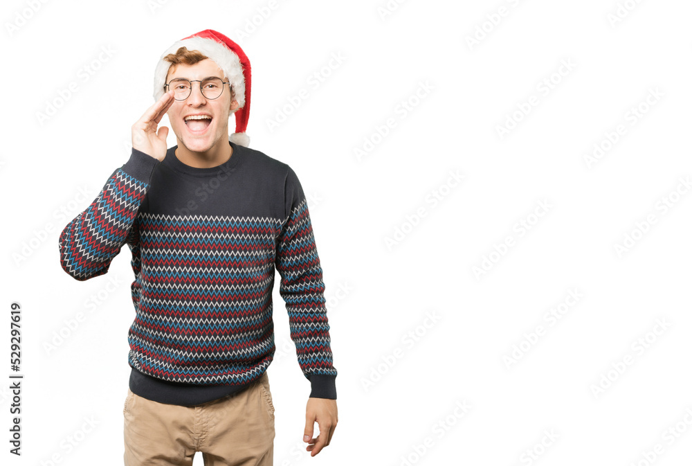 Young man at Christmas doing gestures Young man at Christmas doing gestures