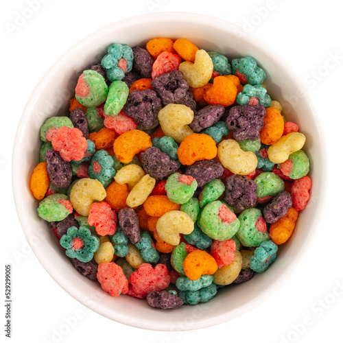 Top view of bowl with fruit cereal naturally and artificially fruit flavored sweetened corn puffs. Cereal fruity shapes. Zenith. Aerial view. Dish containing cereal ready for the preparation of a food