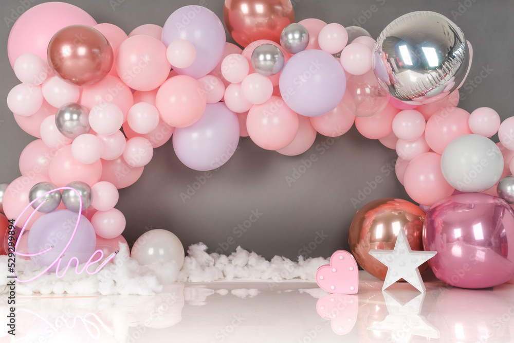 gray background with pink, white and transparent balloons
gray background with pink, white and transparent balloons