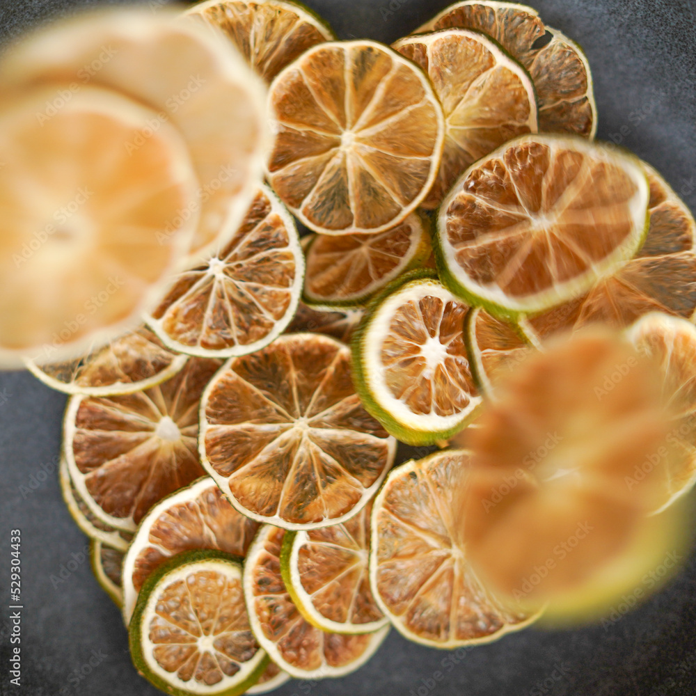 Top view of dehydrated organic Yellow lemon slices. Top view of dehydrated organic Yellow lemon slices.