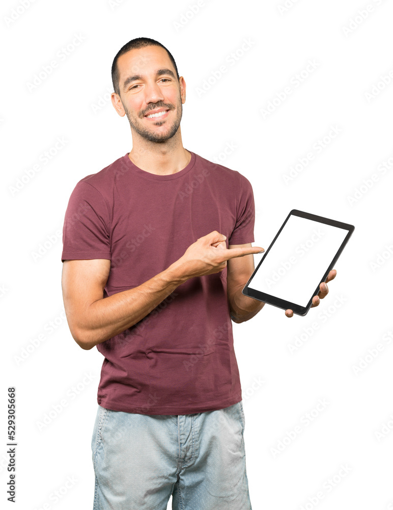 Young man doing gestures using a tablet Young man doing gestures using a tablet