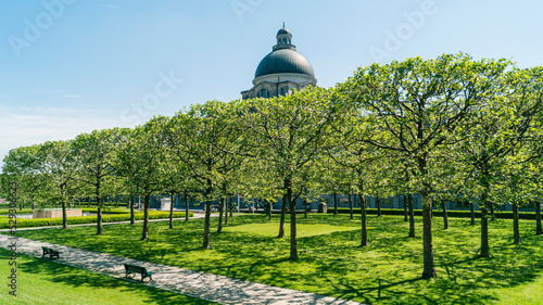 Trees at park in front of Bavarian State Chancellery against sky in city photo