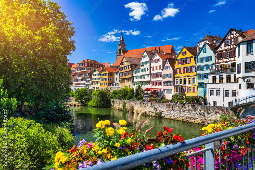 Beautiful floral colorful town Tubingen in Germany (Baden-Wurttemberg). Houses at river Neckar and Hoelderlin tower, Tuebingen, Baden-Wuerttemberg, Germany. Tubingen, Germany.