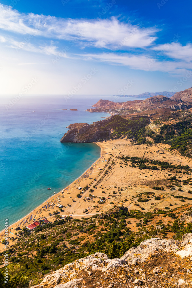 Tsampika beach with golden sand view from above, Rhodes, Greece. Aerial birds eye view of famous beach of Tsampika, Rhodes island, Dodecanese, Greece Tsampika beach with golden sand view from above, Rhodes, Greece. Aerial birds eye view of famous beach of Tsampika, Rhodes island, Dodecanese, Greece