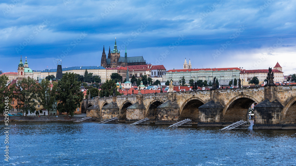 Prague Castle, Charles Bridge and boats on the Vltava river. View of Hradcany Prague Castle, Charles Bridge and a boats on the Vltava river in the capital of the Czechia.