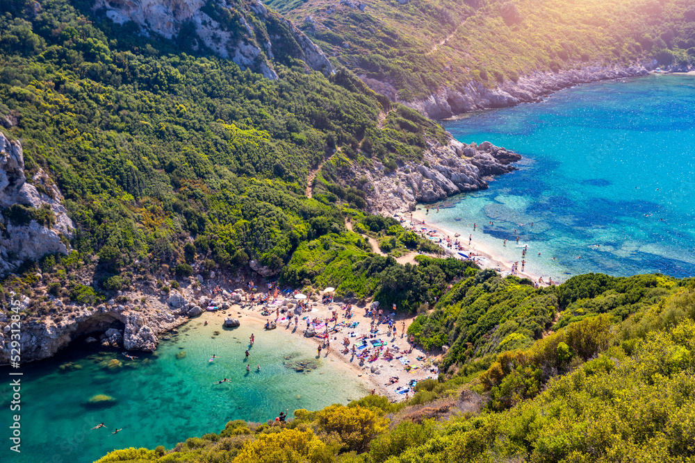 Porto Timoni is an amazing beautiful double beach in Corfu, Greece. Porto Timoni beach at Afionas is a paradise double beach with crystal clear azure water in Corfu, Ionian island, Greece, Europe