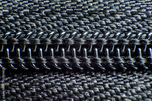 Close-up of black plastic zipper photo