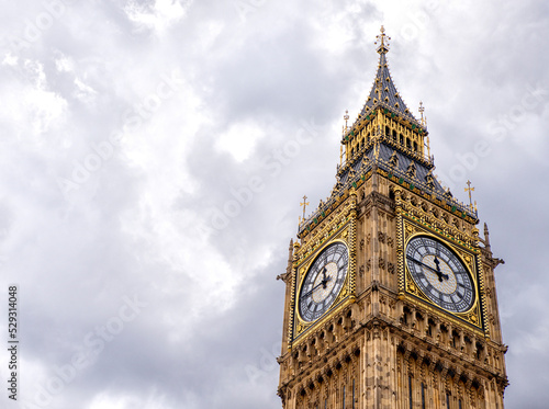 Low angle view of Big Ben against cloudy sky in city photo