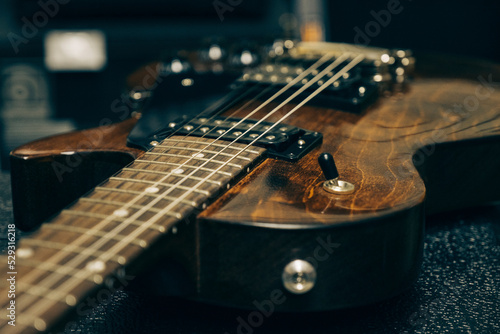 Close-up of guitar on table in studio photo