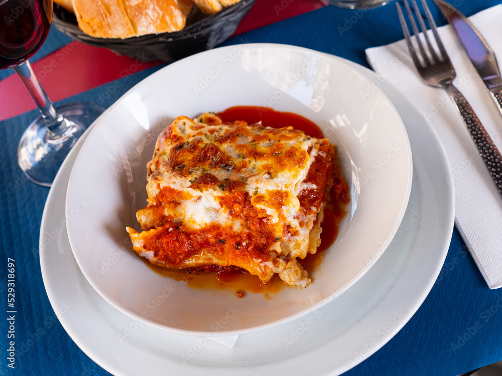Popular dish of Italian cuisine is lasagna a la Bolognese with bechamel sauce