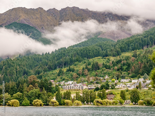 Lakeside residential area of Queenstown, New Zealand, on a drizzly day