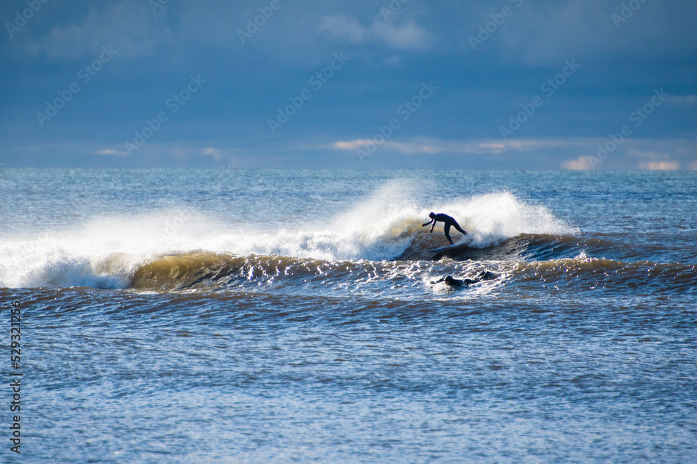 Young Man exploring Nova Scotia for a travel surf trip Young Man exploring Nova Scotia for a travel surf trip