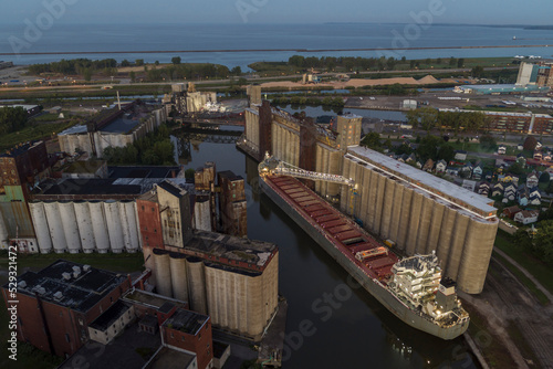 A Commercial Ship Unloads on the Buffalo River, Buffalo, New York photo