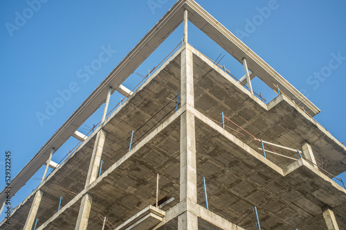 Construction site of a new apartment building. Concre structure on cor photo