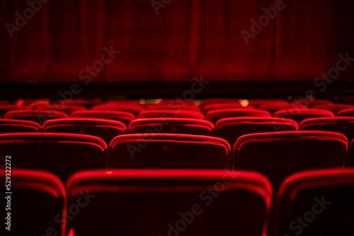 Red seats and curtains of an empty theater photo
