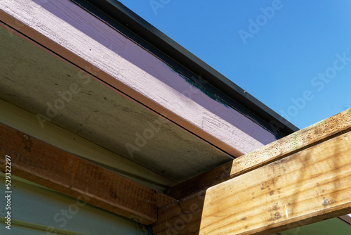 Photography Repaired barge boards painted with primer, renovating an old wooden Kiwi villa or bungalow