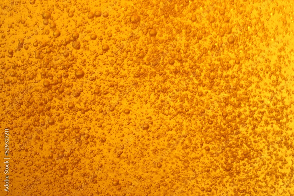 Tasty beer with bubbles as background, closeup Tasty beer with bubbles as background, closeup