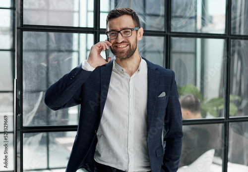 businessman with glasses talking on the phone