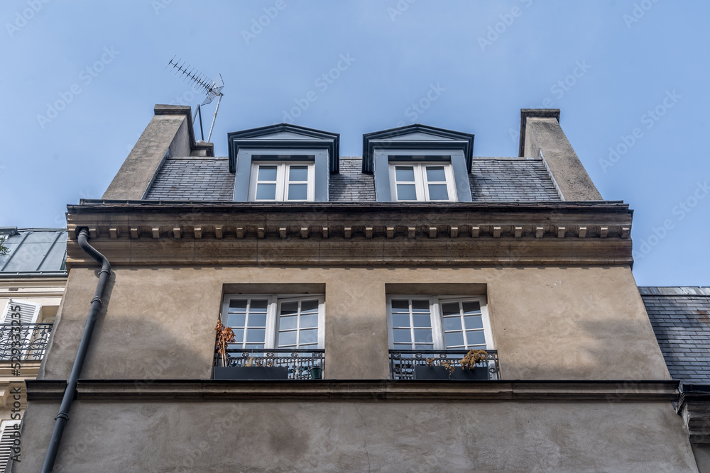 Mansard dormer windows on a classic Parisian house Mansard dormer windows on a classic Parisian house