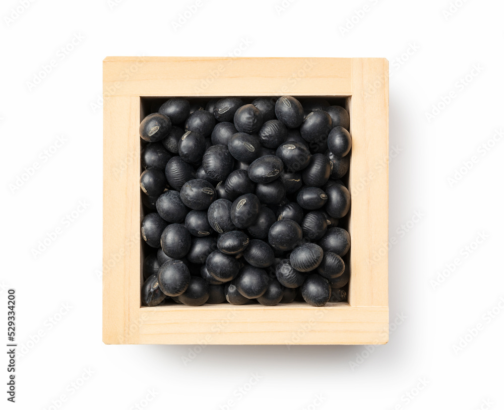 Black soybeans in a masu placed against a white background. Black soybeans (kurodazu). Black soybeans in a masu placed against a white background. Black soybeans (kurodazu).