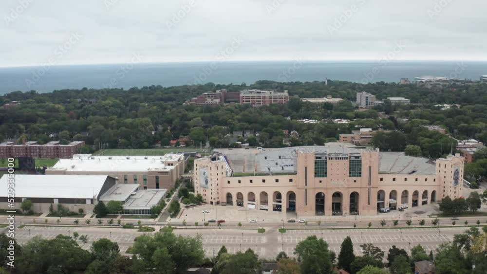 Ryan Field football stadium on the campus of Northwestern University in Evanston, Illinois with drone video wide shot moving sideways. Ryan Field football stadium on the campus of Northwestern University in Evanston, Illinois with drone video wide shot moving sideways.