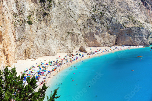 The magnificent Porto Katsiki beach on Lefkada Island, Greece. Beautiful landscape with sea coast, swimming people, trees, azure water.