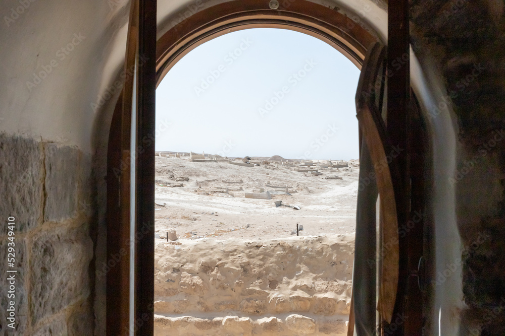 View from the window of the Inner side cell for pilgrims in the Muslim shrine - the complex of the grave of the prophet Moses at the old Muslim cemetery, not far from Jerusalem, in Israel