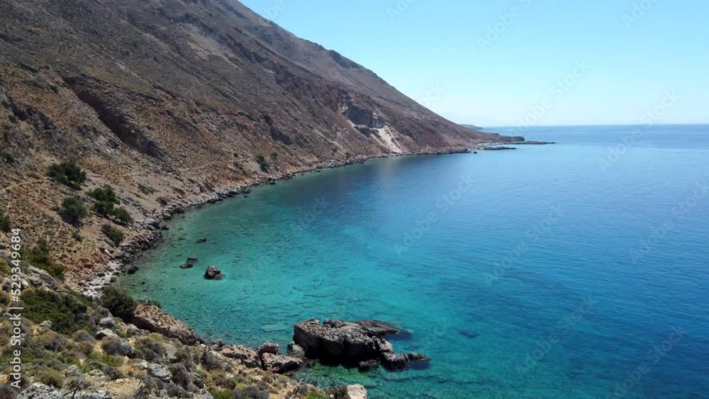 Panoramic view of the meeting between the arid Cretan mountains and the turquoise waters of the Libyan Sea Panoramic view of the meeting between the arid Cretan mountains and the turquoise waters of the Libyan Sea