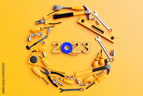 Valokuva 3D illustration inscription 2023 and   hand tools: screwdriver, hammer, pliers, screws, etc