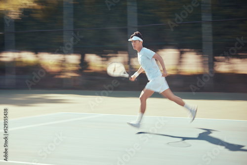 Running, tennis and action with athlete playing on game court for fitness, training and sports workout. Exercise, motivation and young active tennis player in competition match for health and sport