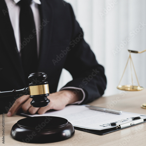 Judge or a lawyer works documents in the courtroom and analyze the various laws for justice and accuracy, Litigation and justice concept.