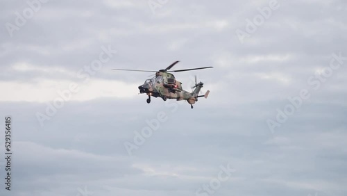 Military ARH Helicopter Pilot Salutes Through Windshield At Brisbane City Riverfire Festival, 4K Slow Motion photo