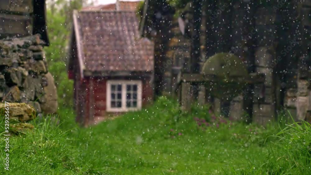 Late summer snowfall in the high-altitude mountains of a Norway village - slow motion Late summer snowfall in the high-altitude mountains of a Norway village - slow motion