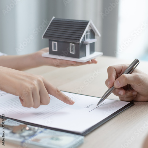 Contract signing, Home broker or salesperson allows customers to sign a contract to purchase a home as a legitimate homeowner. Transfer of ownership