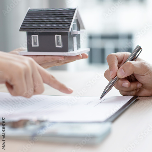 Contract signing, Home broker or salesperson allows customers to sign a contract to purchase a home as a legitimate homeowner. Transfer of ownership