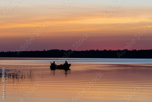 Fishing at sunset on Minnesota lake