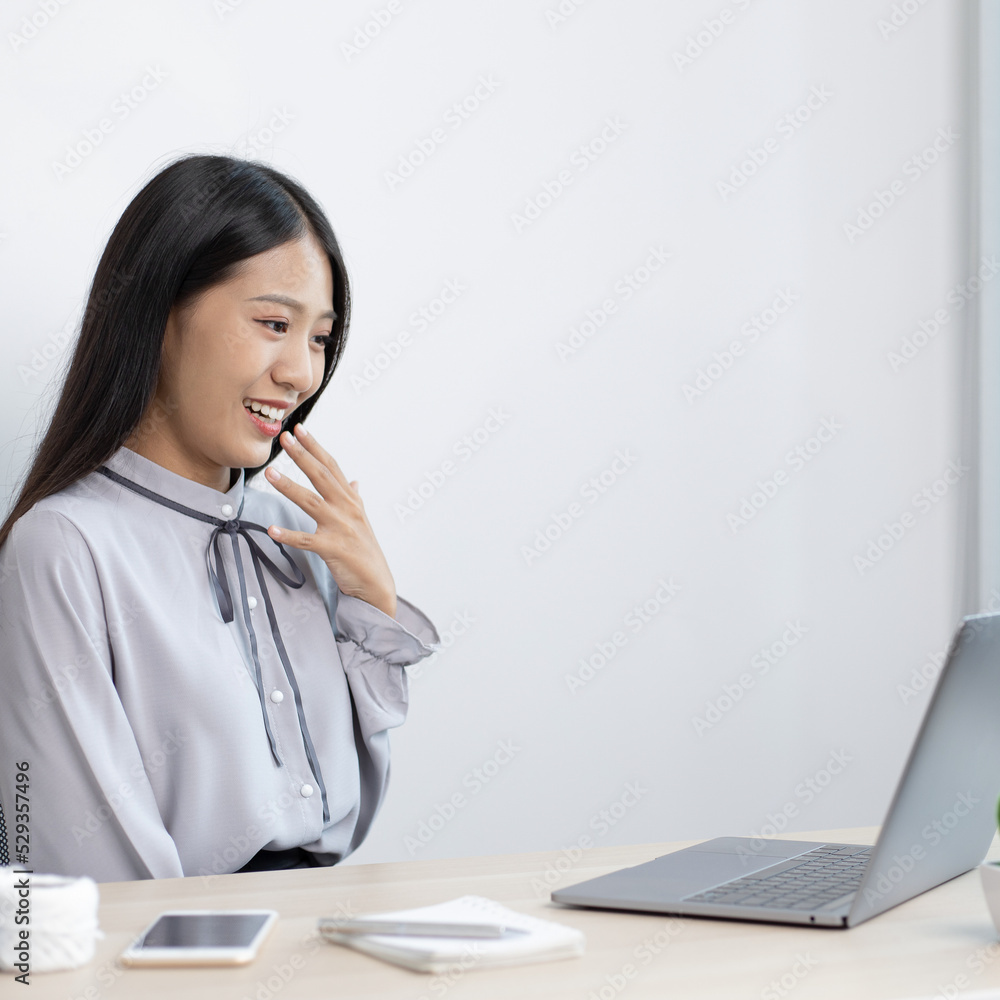Young woman was happy after receiving an order from an internet customer, Entrepreneurs selling products online or doing freelance work at home concept. Young woman was happy after receiving an order from an internet customer, Entrepreneurs selling products online or doing freelance work at home concept.