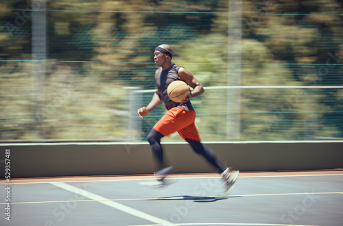 Fitness, sports and basketball player in action running on the court for a cardio workout, training and exercise. Wellness, energy and healthy black man or athlete playing an active game in summer