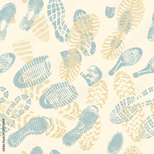 Vector seamless pattern color images double footprints yellow and blue on beige background