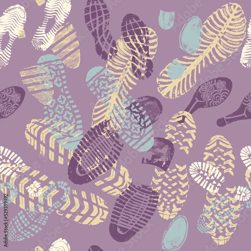 Vector seamless pattern color images double footprints yellow violet and blue on violet background