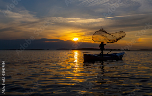 Fisherman of Lake Manyas at work while fishing photo