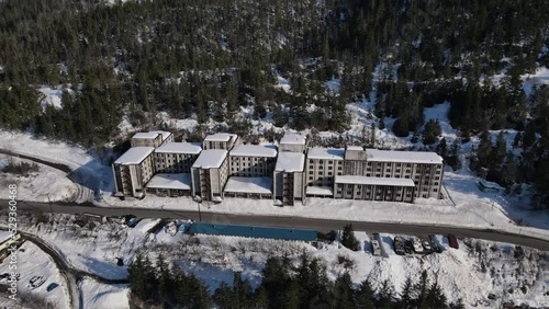 Aerial view of the abandoned Buckner building in Whitter Alaska during the winter with snow on the rooftop, world war 2 building  photo
