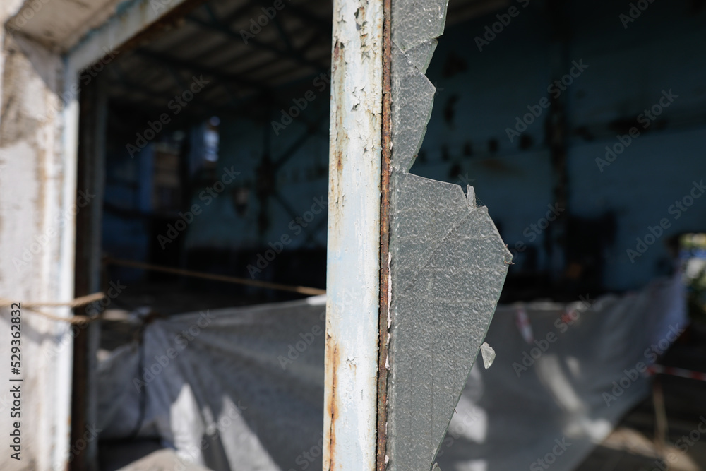 Broken walls and windows in an abandoned industrial building. Broken walls and windows in an abandoned industrial building.