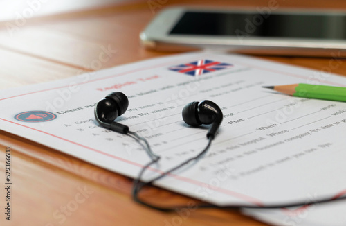English listening test on wooden desk