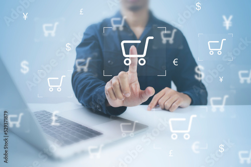 Businessman using computer and touch virtual screen online shopping. And online payment option or digital wallet online transaction concept.