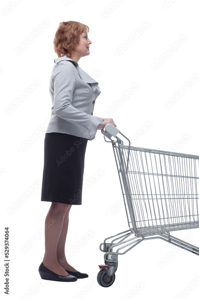 Side view of happy woman pushing an empty shopping cart Side view of happy woman pushing an empty shopping cart