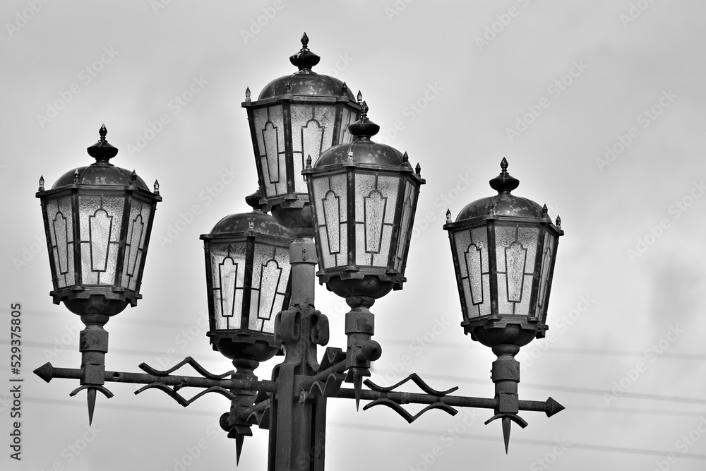Street lights in the old style on an autumn day
