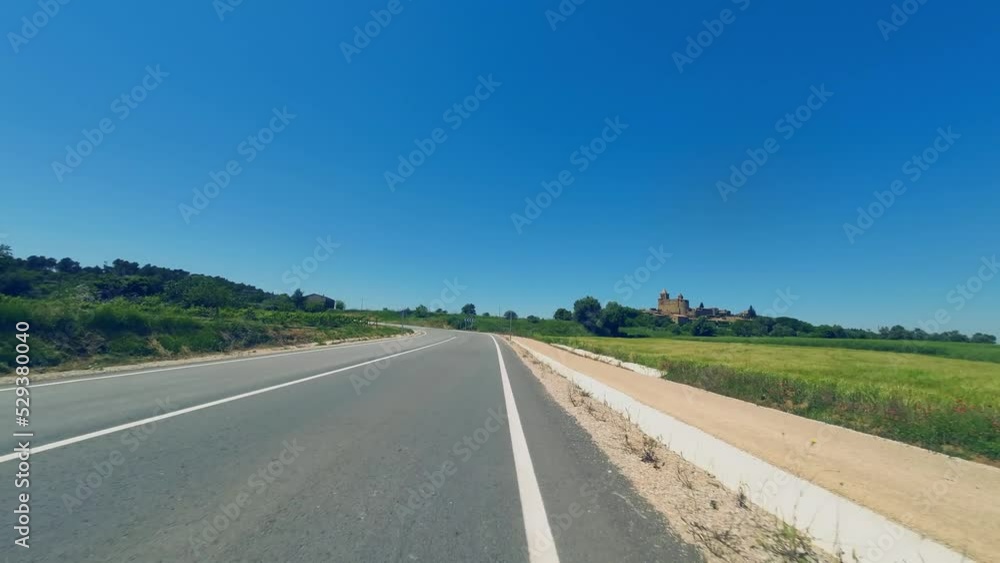 POV shot from the handlebars of a road cyclist riding along the Spanish countryside on a sunny day, Catalunya, Spain POV shot from the handlebars of a road cyclist riding along the Spanish countryside on a sunny day, Catalunya, Spain