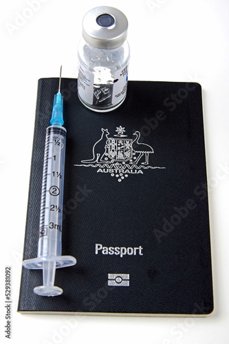 australian passport with medical syringe and medication   