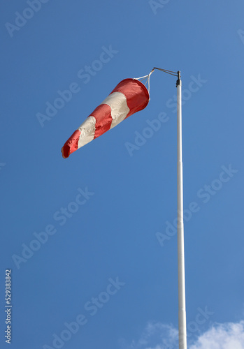 red and white windsock to indicate the direction of the air flow